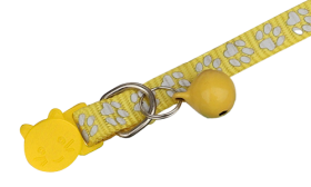 Yellow paw-patterned breakaway cat collar, adjustable and lightweight for comfort, reflective feature with matching bell.