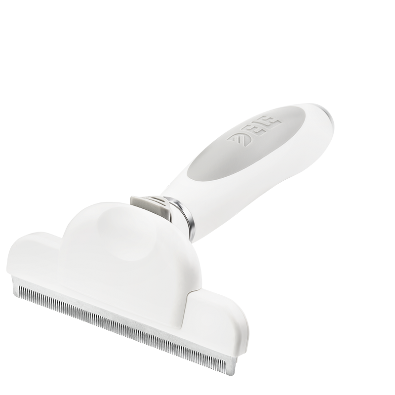 Dog and Cat Deshedding Brush Large white deshedding brush for dogs with fine metal teeth and ergonomic handle, to reduce shedding and remove loose fur.
